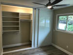 master bedroom remodel with glass closet doors